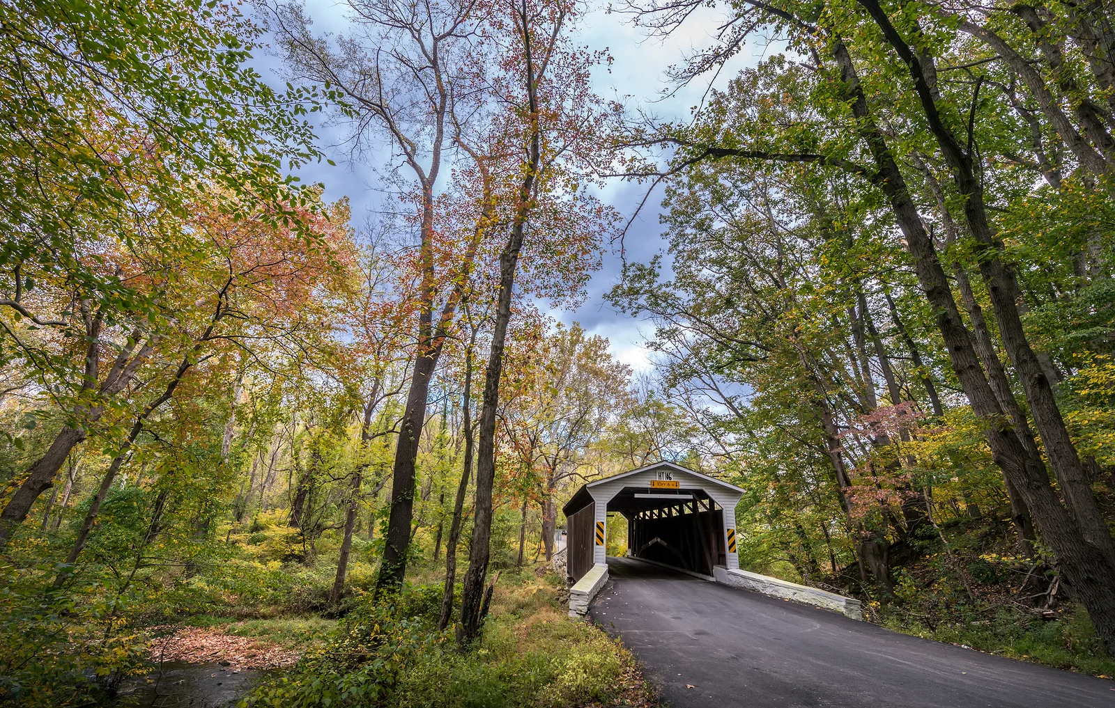 Rustic Old Covered Bridge In The Rural Pennsylvania Countryside Rustic old covered bridge in the rural Pennsylvania countryside during Autumn